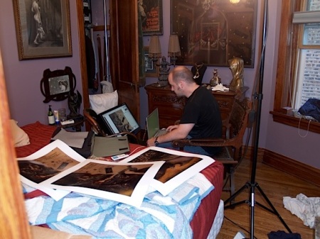 Jim Kay with multiple color variations of "Mélies (Untitled)" checks them against the monitor.